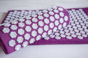 Полезен ли аппликатор Кузнецова при болях в спине